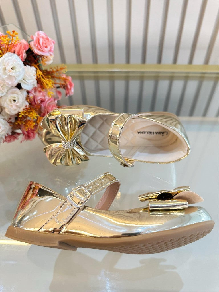 Zapato dorado metálico de lujo con lazo y pedrería