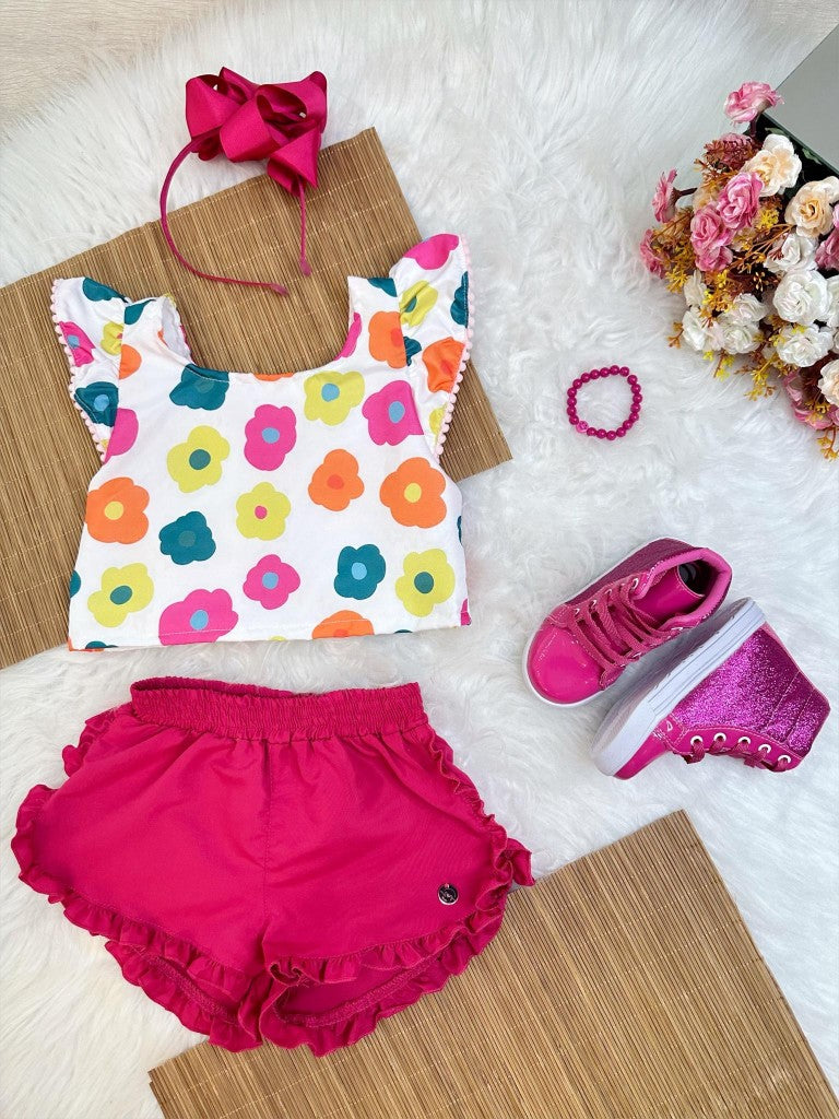 Conjunto floral blanco para niña con pantalón corto rosa y pulsera