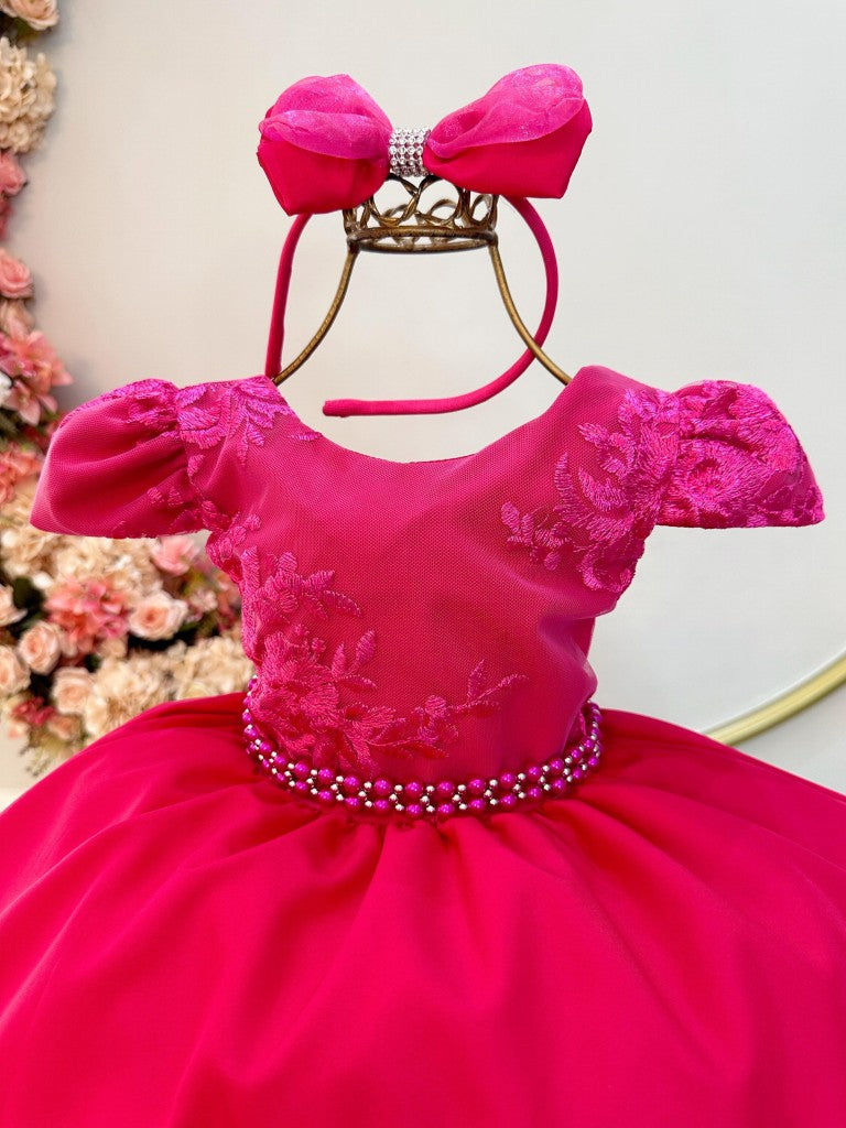 Vestido infantil rosa con tiara de encaje y cinturón de perlas