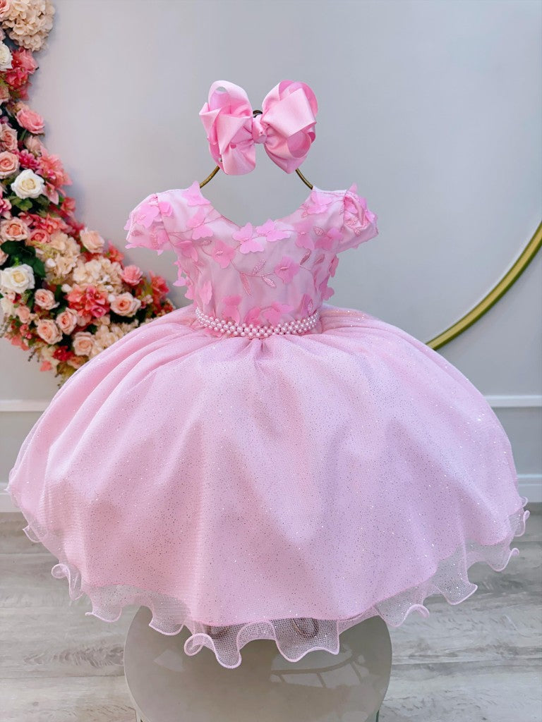 Vestido infantil rosa claro con falda brillante y apliques de flores
