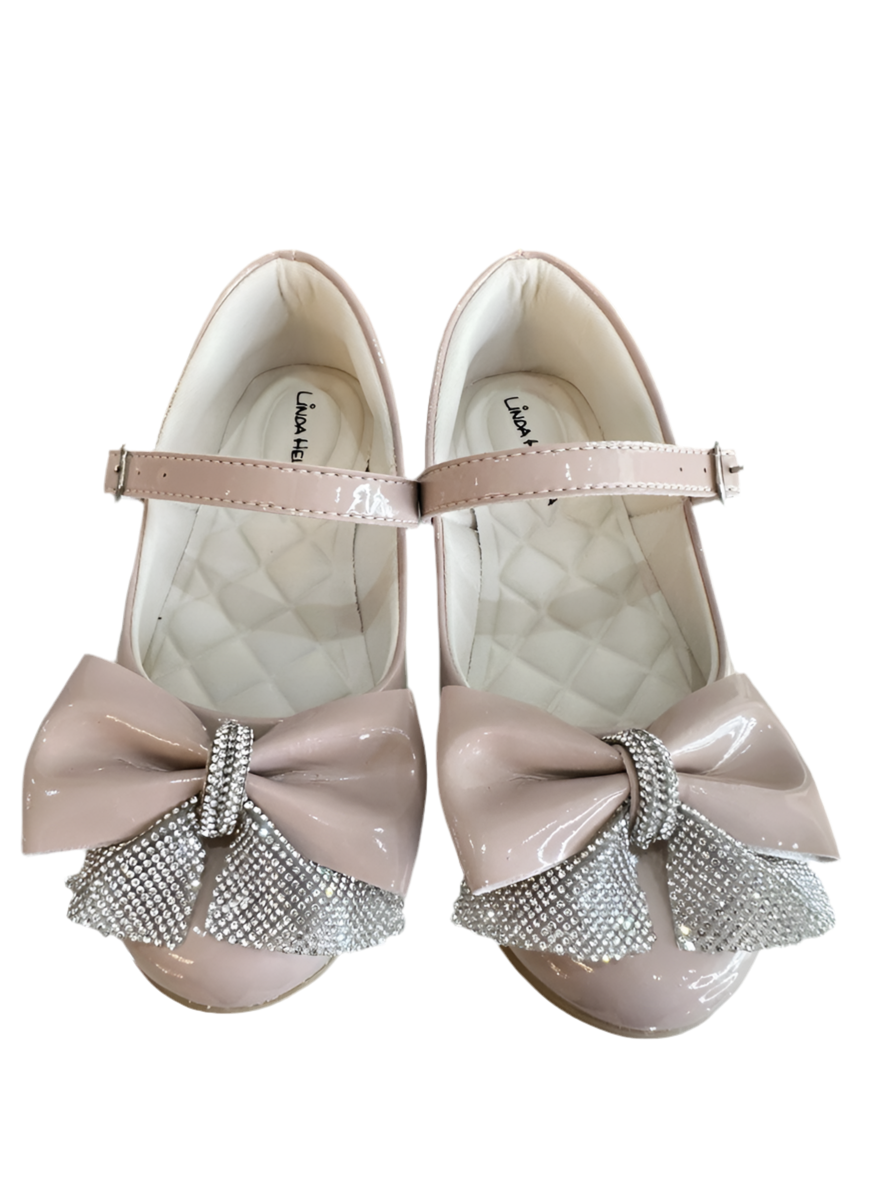 Zapatos infantiles de charol color nude con aplique de lazo de diamantes de imitación 