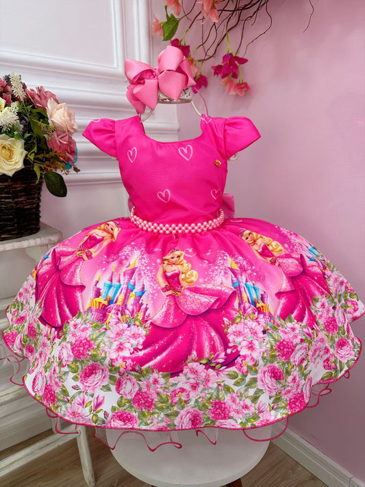 Vestido rosa chicle de Barbie con cinturón de perlas