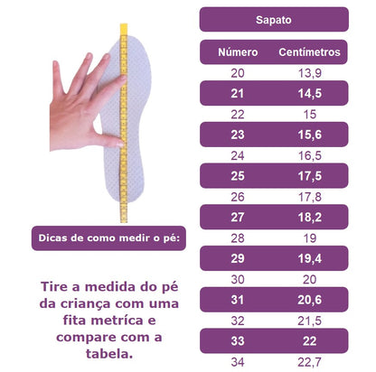 Zapato de charol rosa con lazo, perlas y pedrería