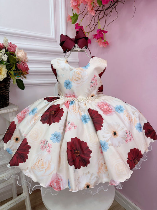Vestido infantil color marfil con flores primaverales y cinturón de perlas