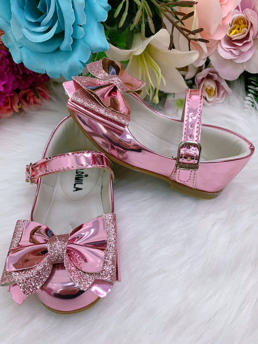 Zapatos rosas metalizados con lazo de purpurina de lujo 