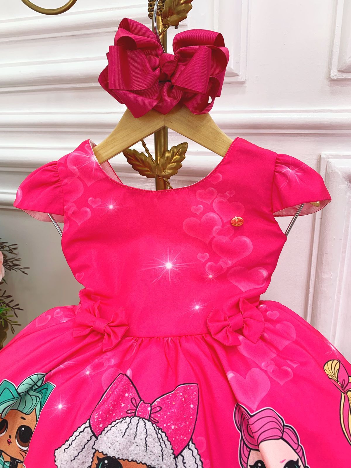 Vestido infantil floral rosa de Lol con broches de lazo
