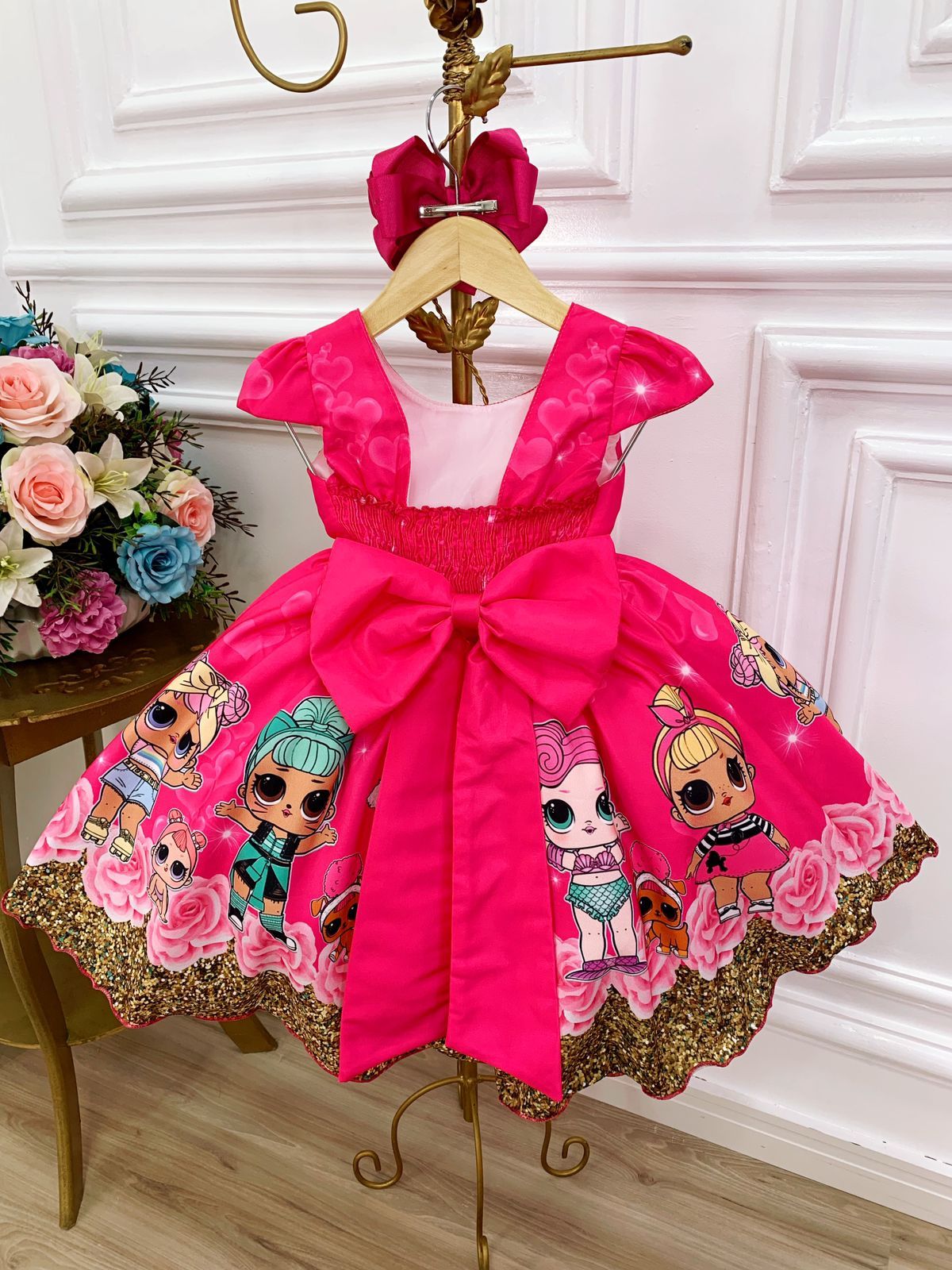 Vestido infantil floral rosa de Lol con broches de lazo
