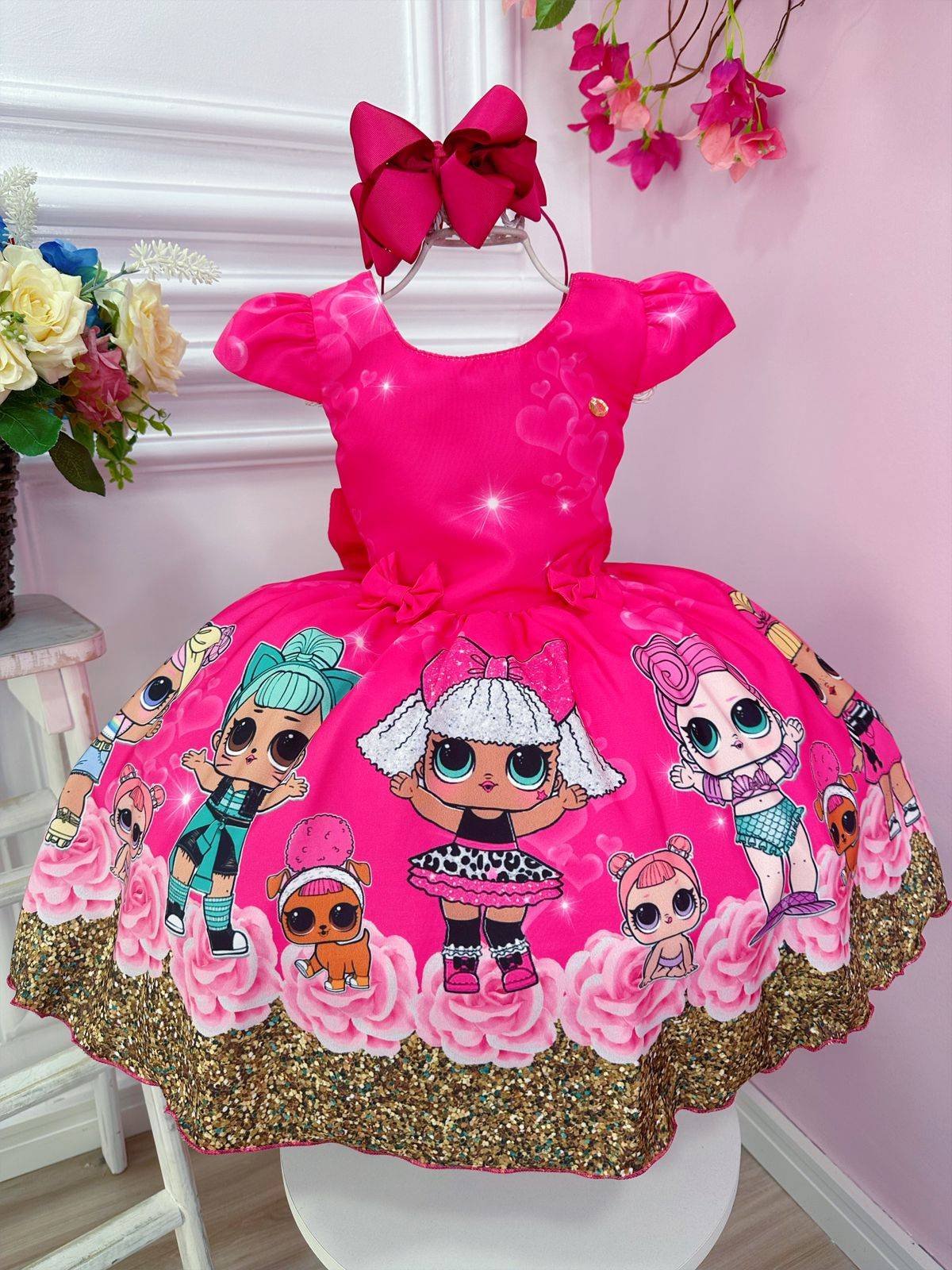 Vestido infantil floral rosa de Lol con broches de lazo
