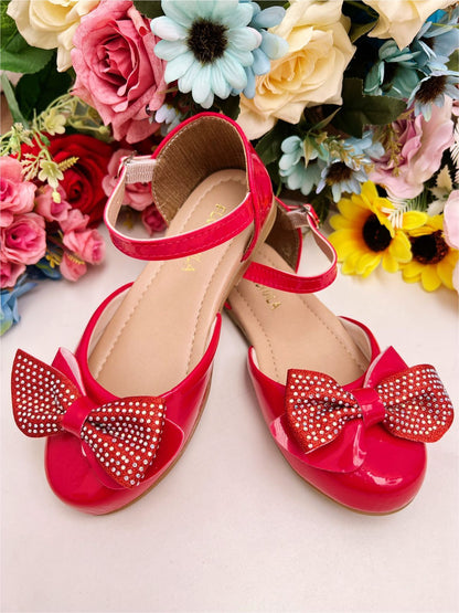 Zapatos de charol rojo con lazo y pedrería de lujo 