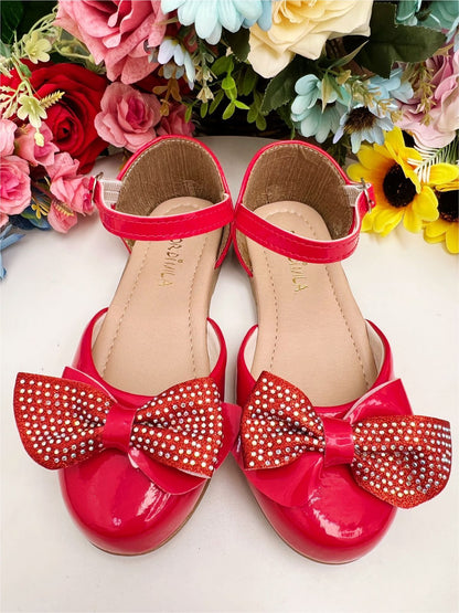 Zapatos de charol rojo con lazo y pedrería de lujo 