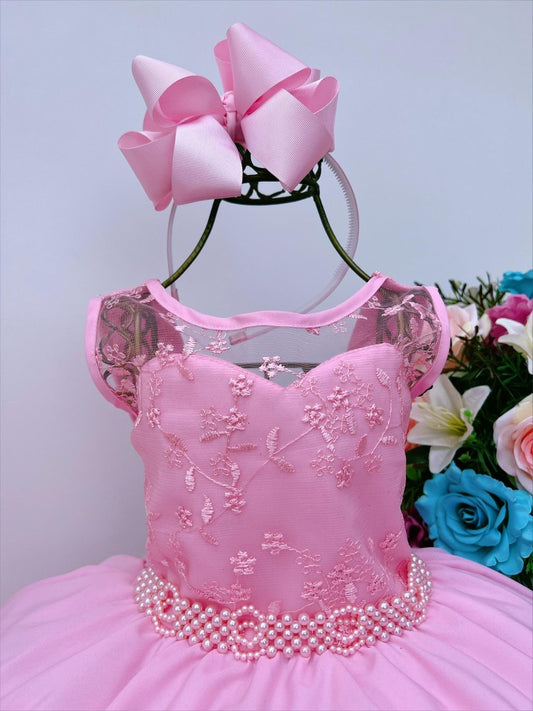 Vestido infantil rosa chicle con encaje y cinturón de perlas