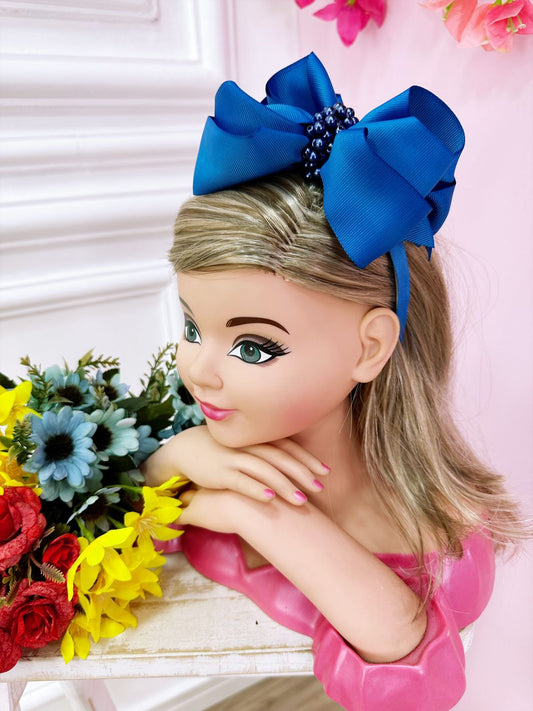 Tiara infantil con nudo Maxx azul real y perlas de lujo