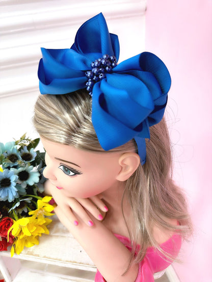 Tiara infantil con nudo Maxx azul real y perlas de lujo