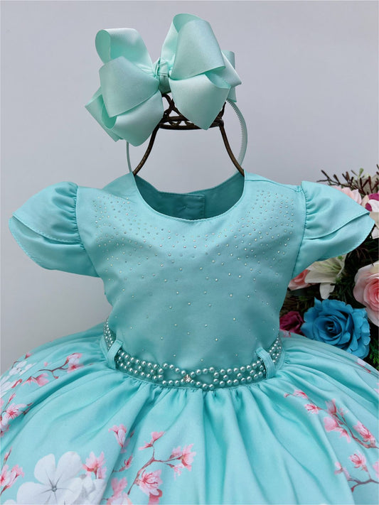 Vestido infantil verde con pedrería y perlas en diseño floral