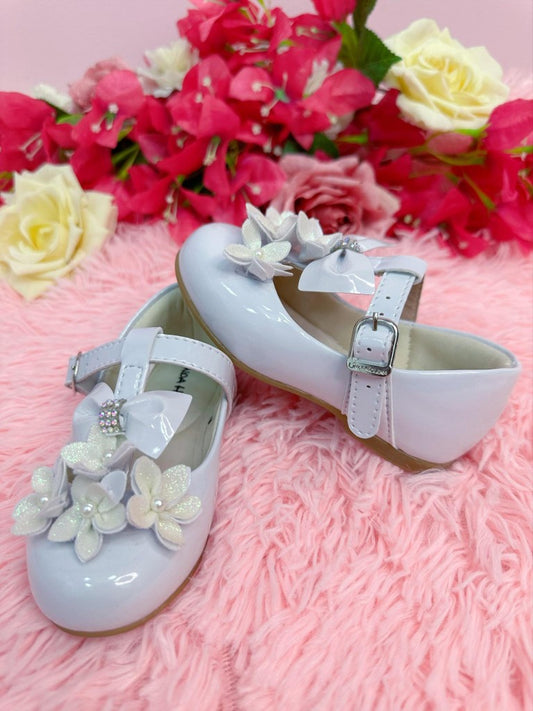 Zapatos de charol blanco con aplique de flores y lazo de lujo 
