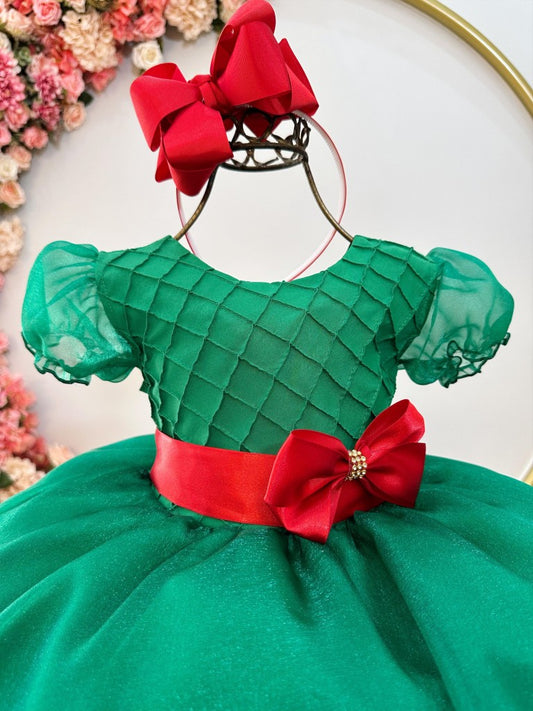 Vestido infantil verde con busto plisado y broche de fiesta navideña