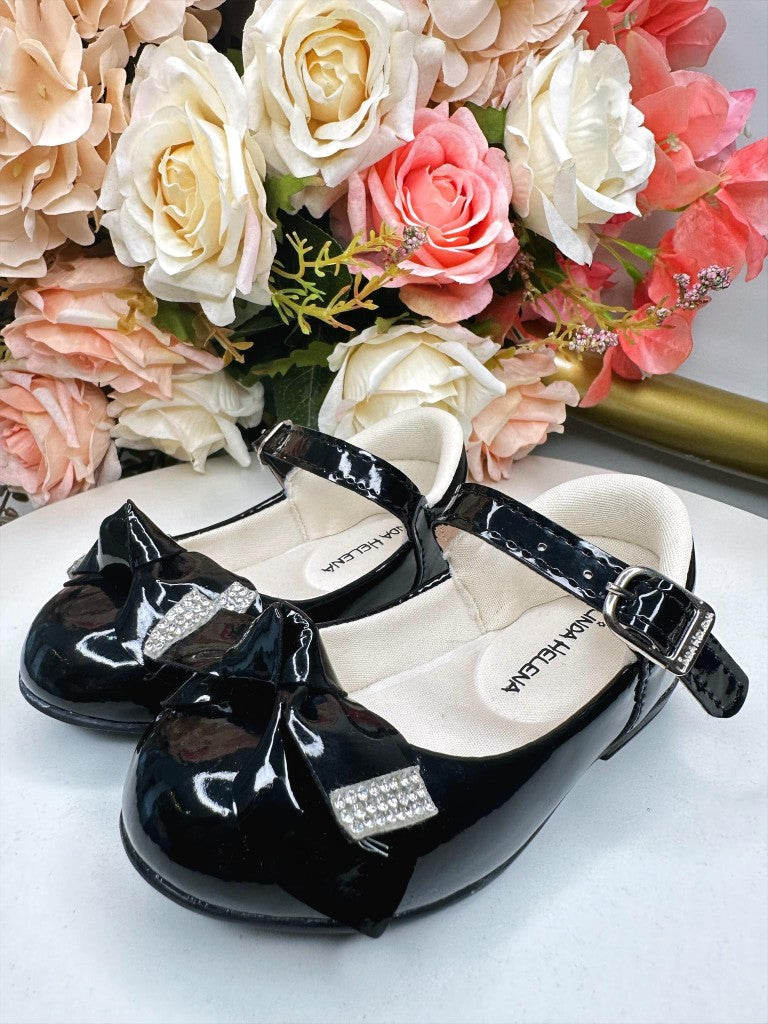 Zapatos de charol negro con lazo y aplique de diamantes de imitación