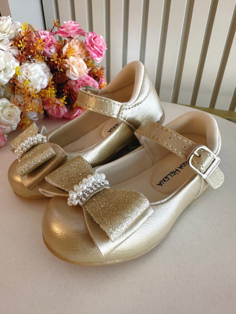 Zapato dorado con aplique de lazo y pedrería brillante 