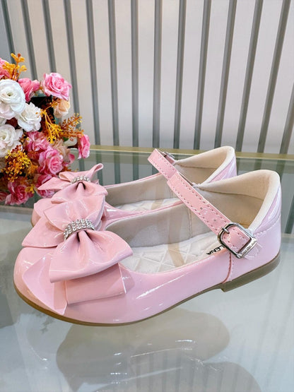 Zapatos de charol rosa de lujo con lazo y pedrería 