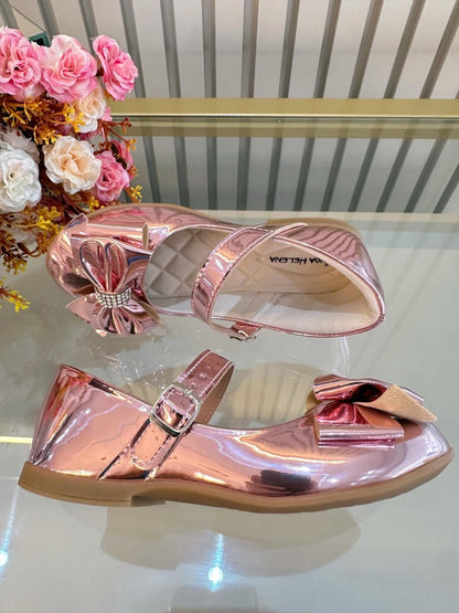 Zapato rosa metalizado de lujo con lazo y pedrería 