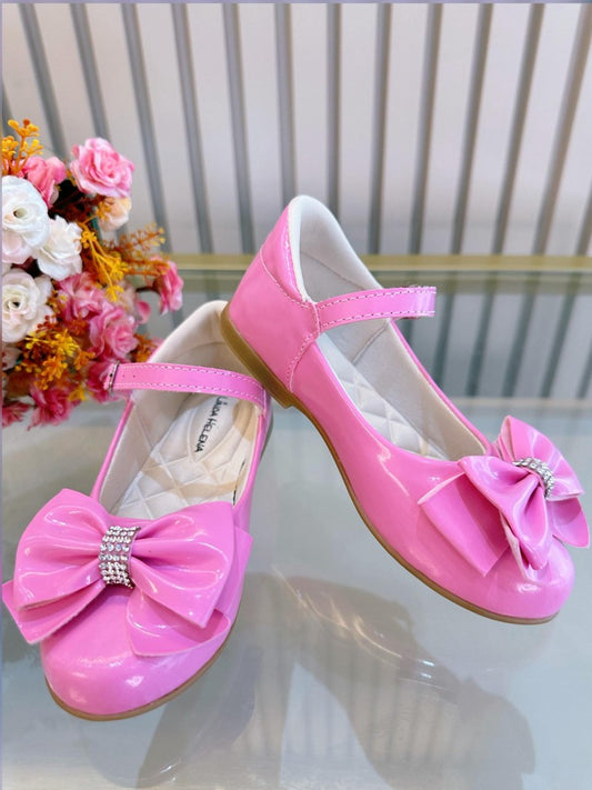 Zapato de charol de lujo rosa chicle con lazo y pedrería 