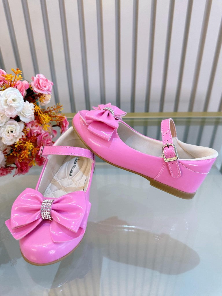 Zapato de charol de lujo rosa chicle con lazo y pedrería 