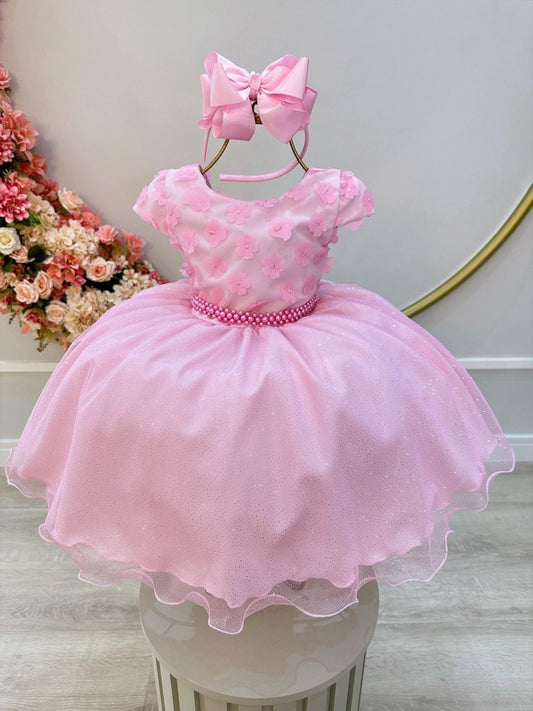 Vestido infantil rosa con falda brillante y apliques de flores