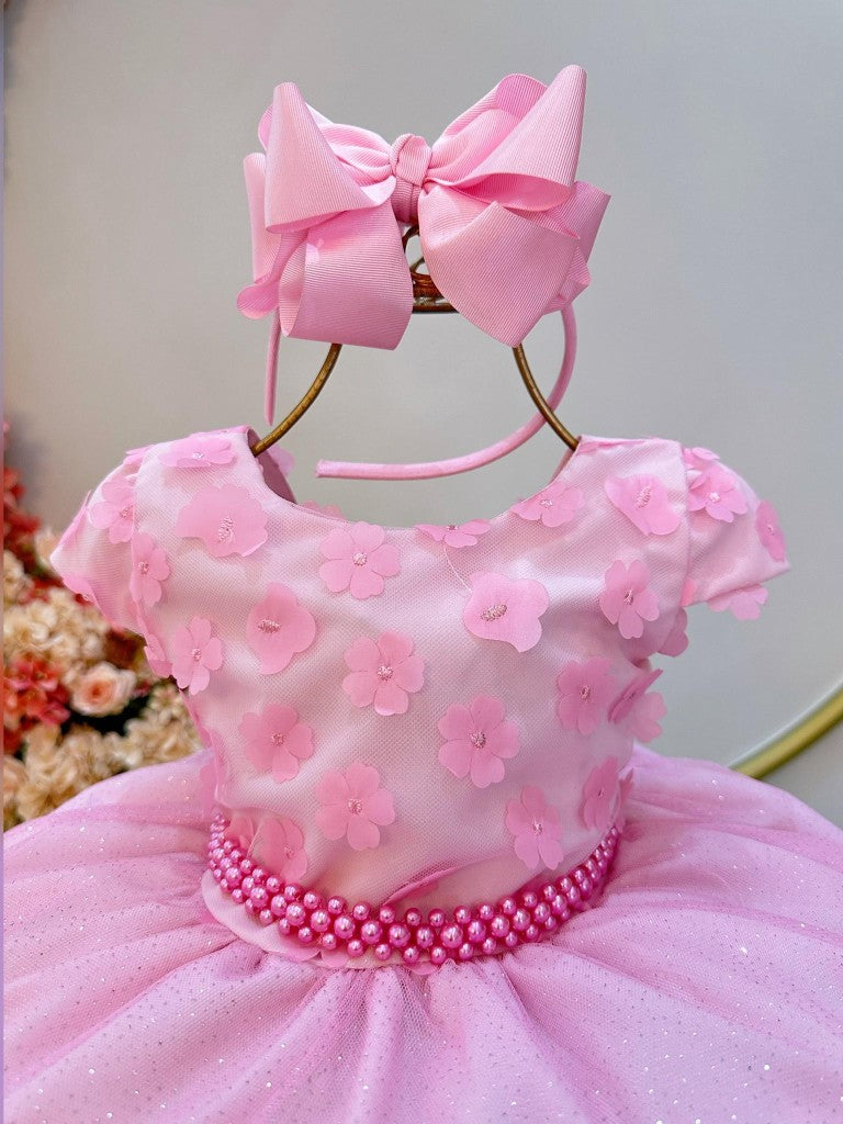 Vestido infantil rosa con falda brillante y apliques de flores