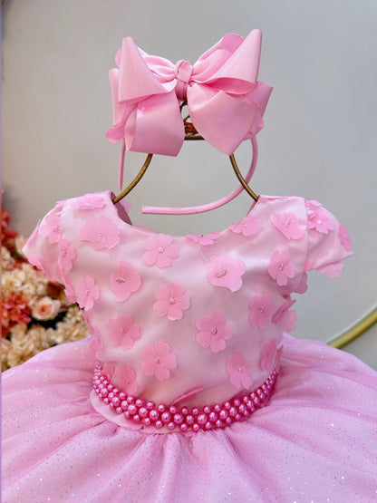 Vestido infantil rosa con falda brillante y apliques de flores