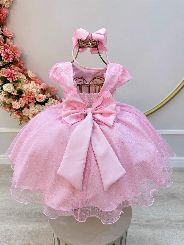 Vestido infantil rosa con falda brillante y apliques de flores