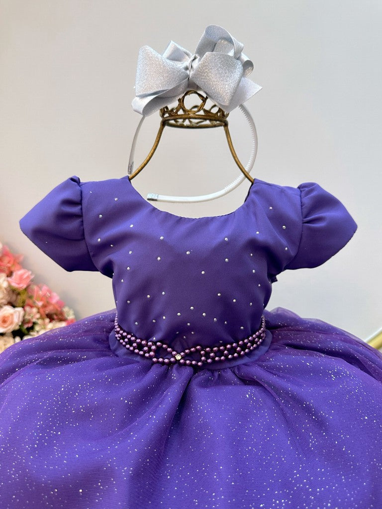 Vestido infantil morado con busto de pedrería y falda con purpurina