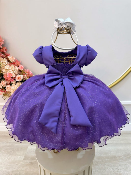 Vestido infantil morado con busto de pedrería y falda con purpurina