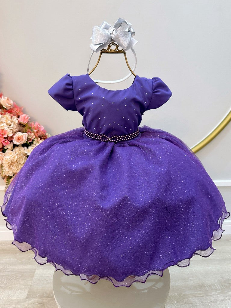 Vestido infantil morado con busto de pedrería y falda con purpurina