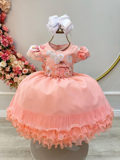 Vestido infantil color salmón y falda con volantes y busto de flores con pedrería