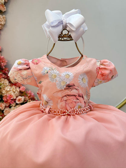Vestido infantil color salmón y falda con volantes y busto de flores con pedrería