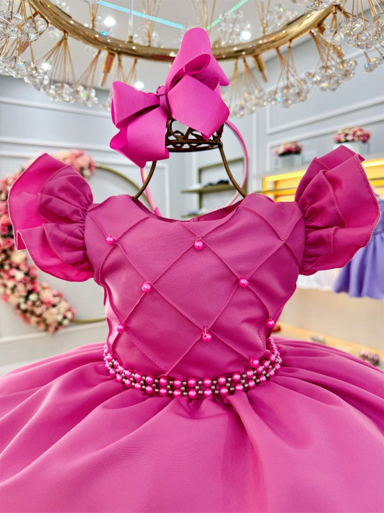 Vestido infantil rosa chicle con perlas y busto acanalado