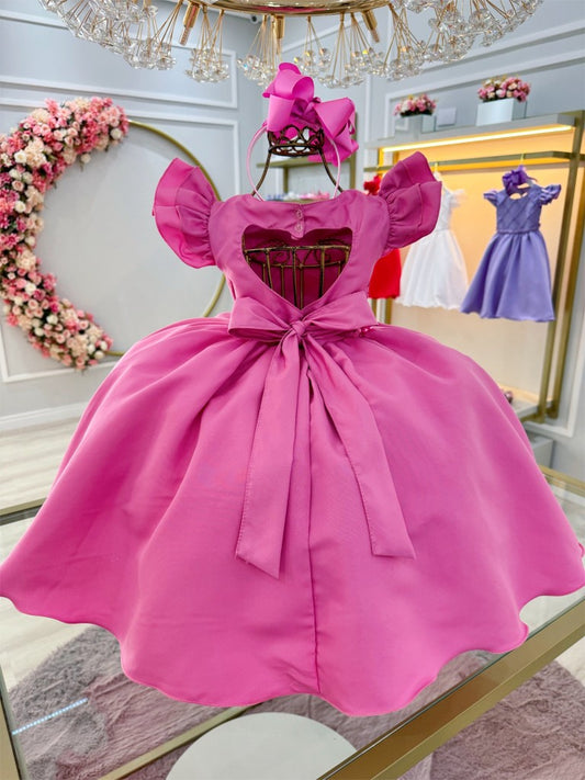 Vestido infantil rosa chicle con perlas y busto acanalado