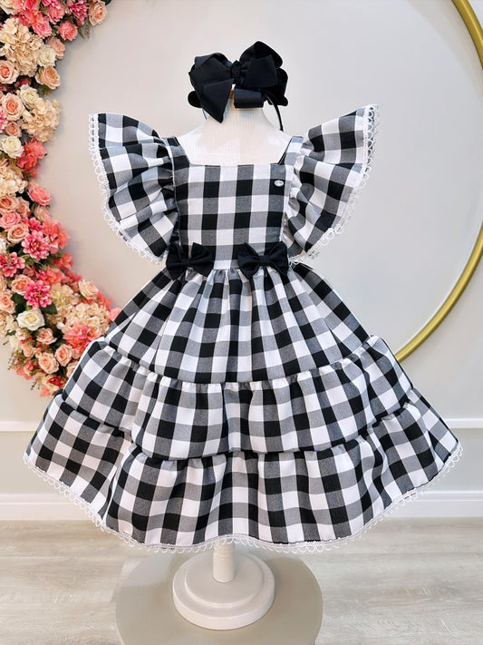 Vestido infantil a cuadros en blanco y negro con broche de lazo