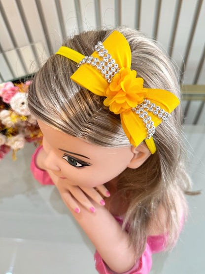 Diadema para bebé con lazo de flores y pedrería en varios colores 