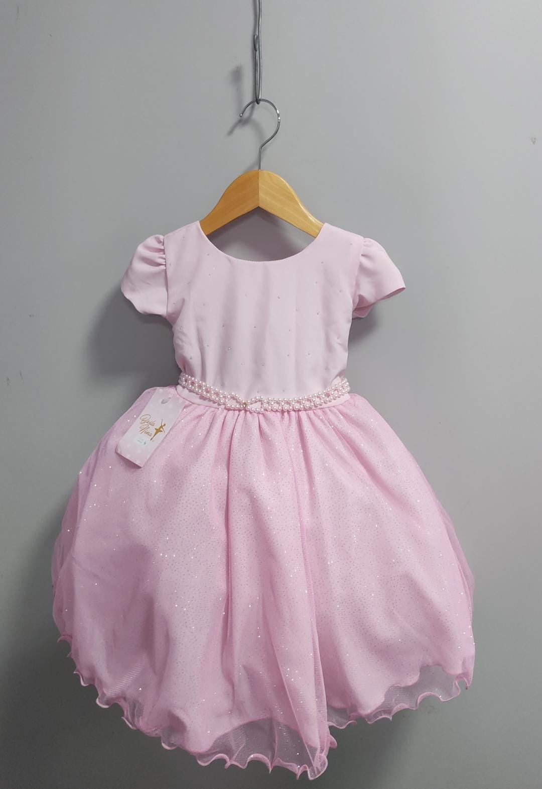 Vestido infantil rosa claro con busto de pedrería y falda con purpurina