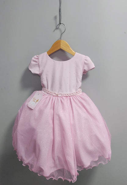 Vestido infantil rosa claro con busto de pedrería y falda con purpurina