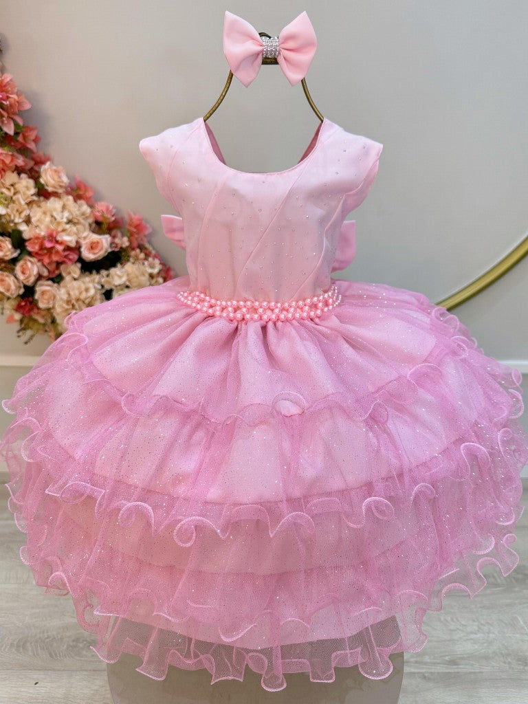Vestido infantil rosa claro con volantes y falda brillante