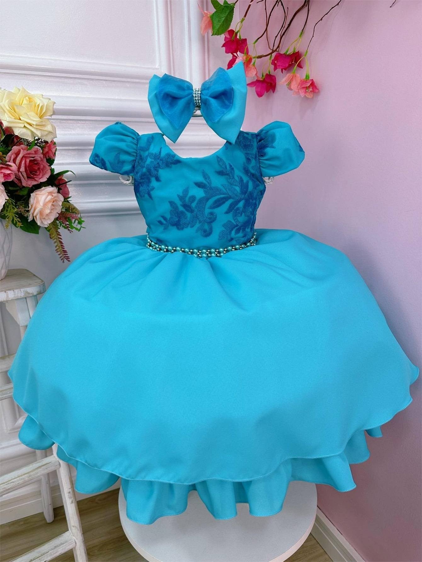 Vestido infantil verde con lazo de encaje y cinturón de perlas