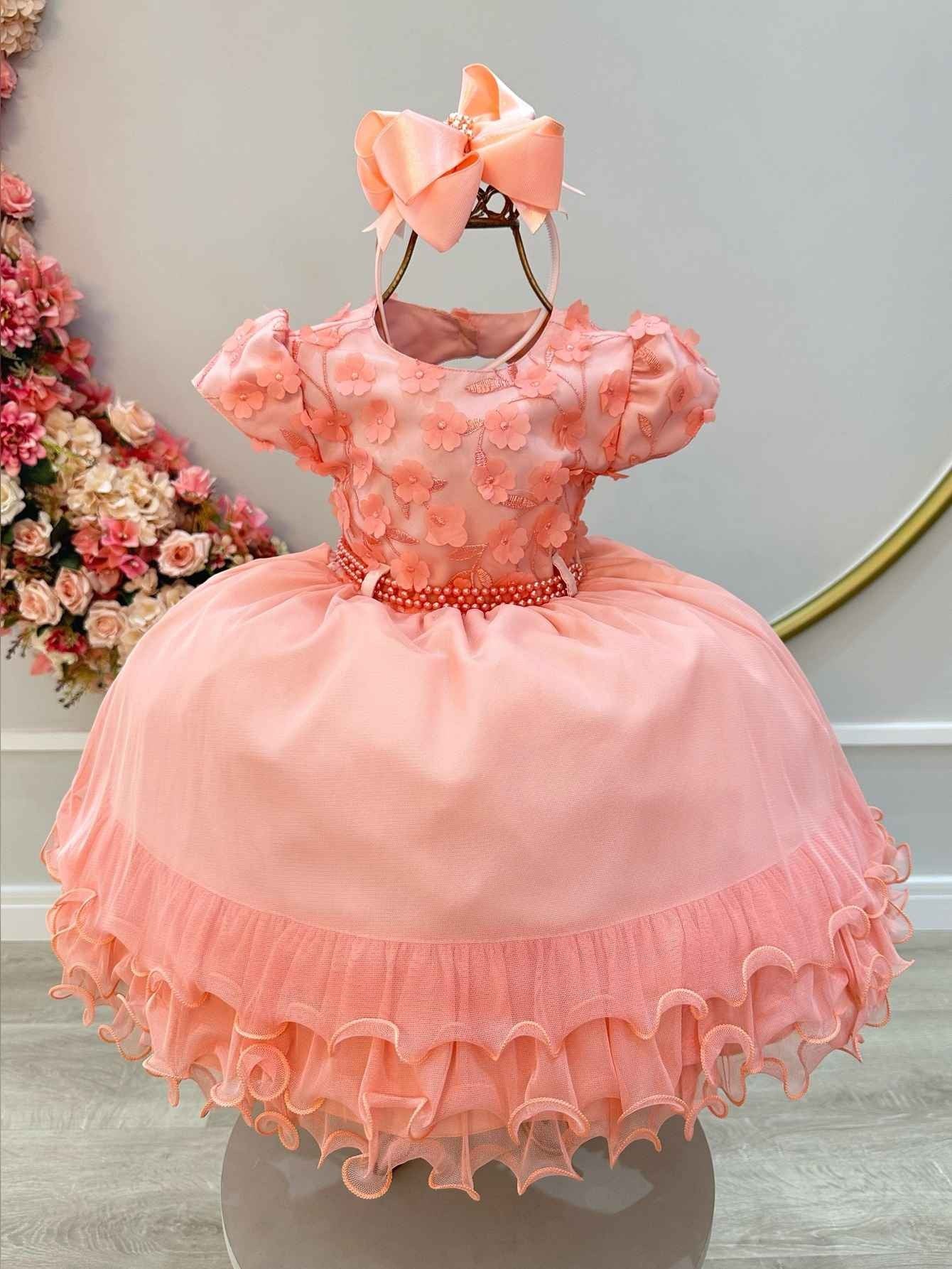 Vestido infantil color salmón con apliques de flores y encaje de lujo