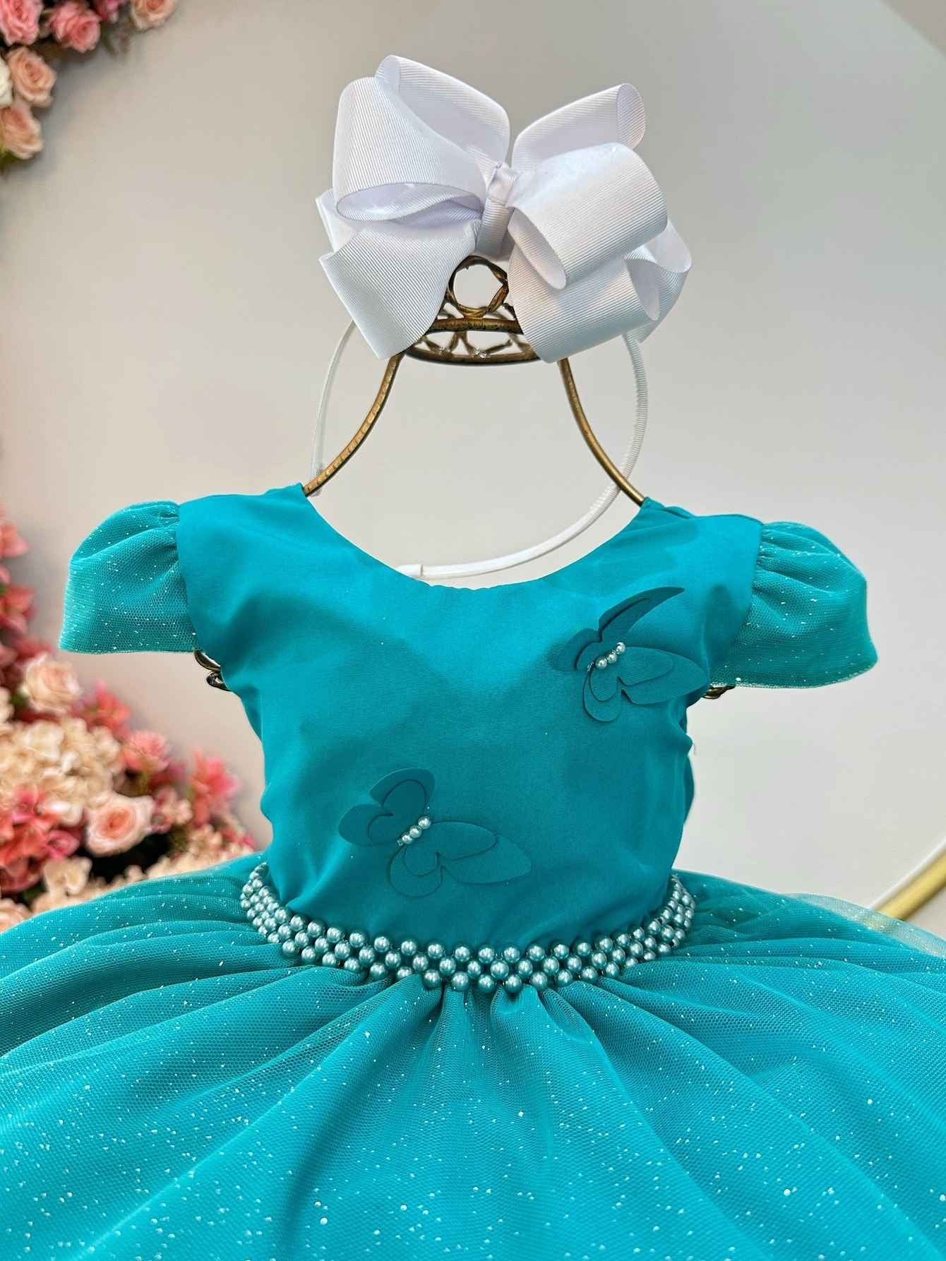 Vestido infantil verde con apliques de mariposas brillantes