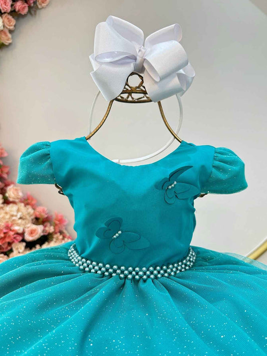 Vestido infantil verde con apliques de mariposas brillantes