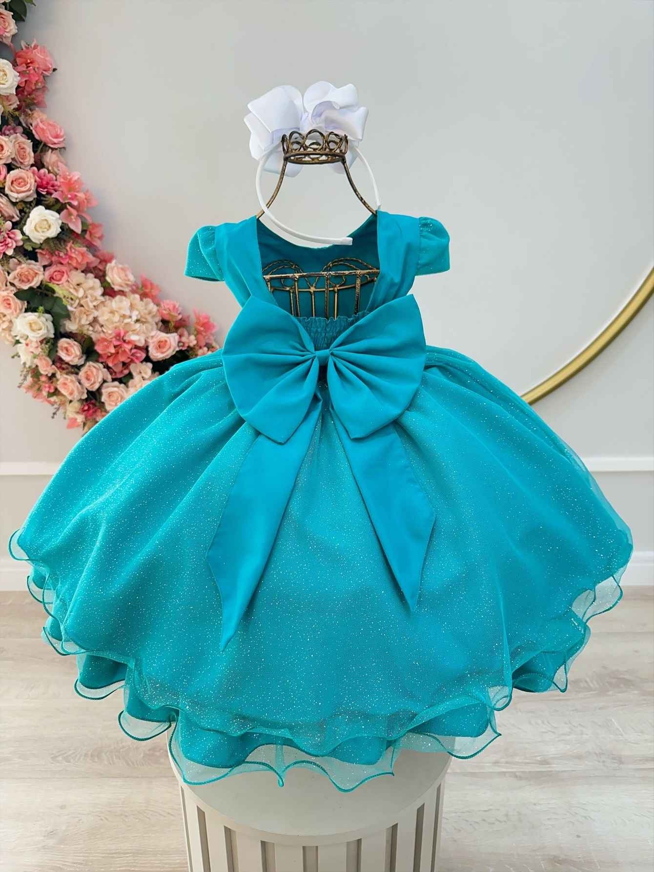 Vestido infantil verde con apliques de mariposas brillantes