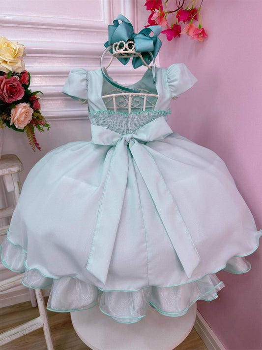 Vestido infantil verde claro con cinturón de perlas para bodas