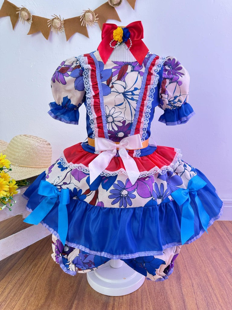 Disfraz infantil de junio con flores de colores azules y rojas 