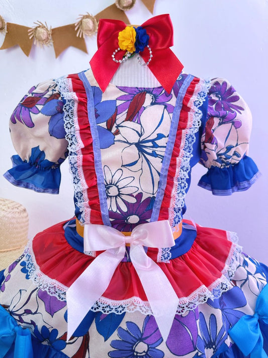 Disfraz infantil de junio con flores de colores azules y rojas 